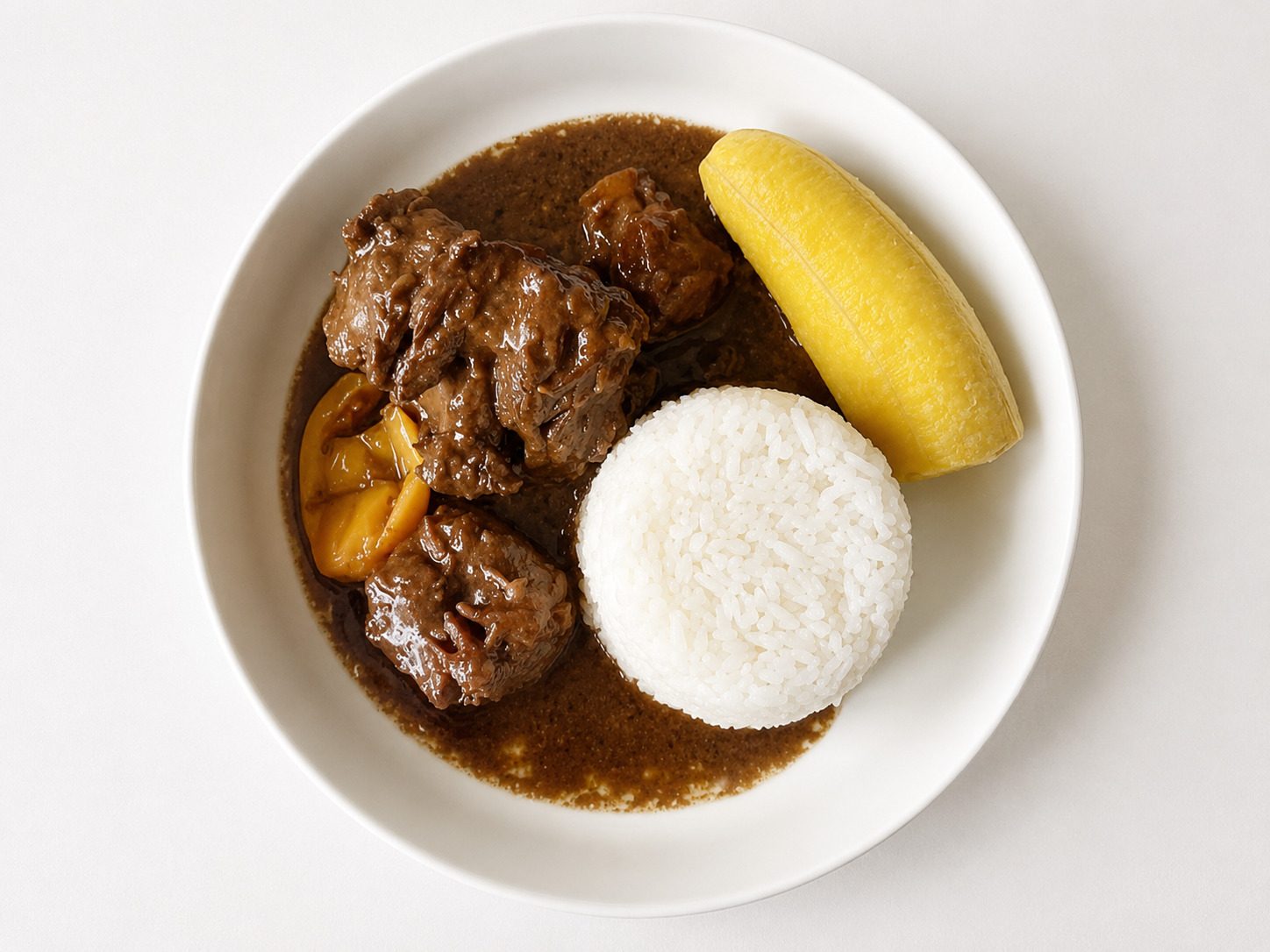 A Plate Filled With Odika Sauce And Rice