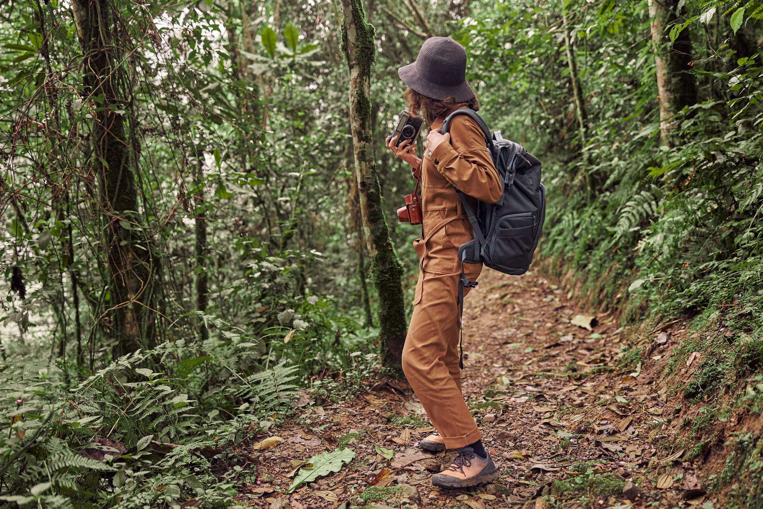 A Young Tourist Trekking Amid The Forest