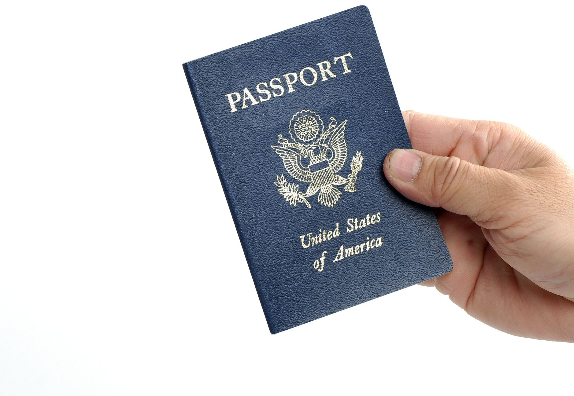 Hand holding a United States passport