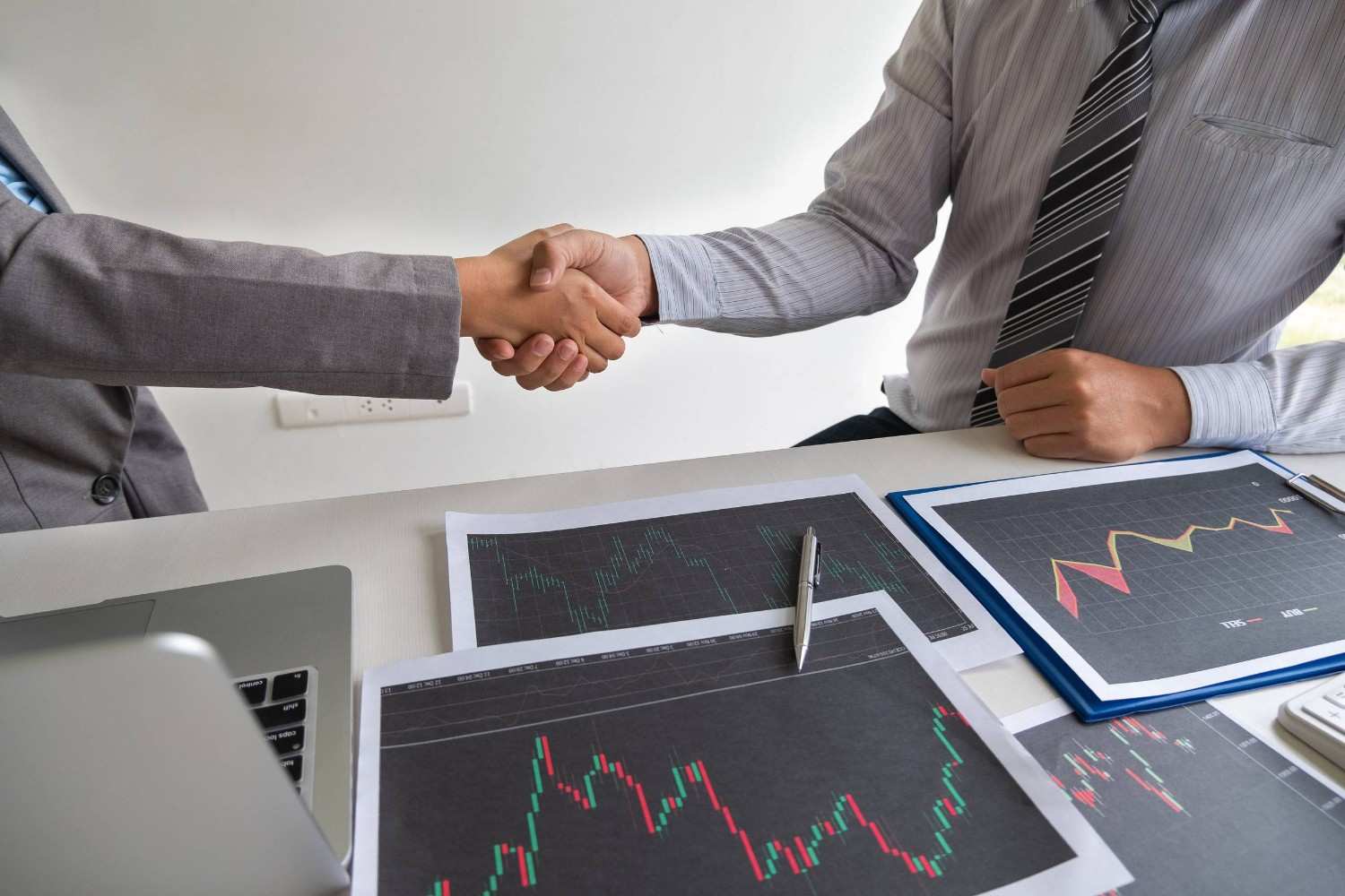 Investors Shaking Hands