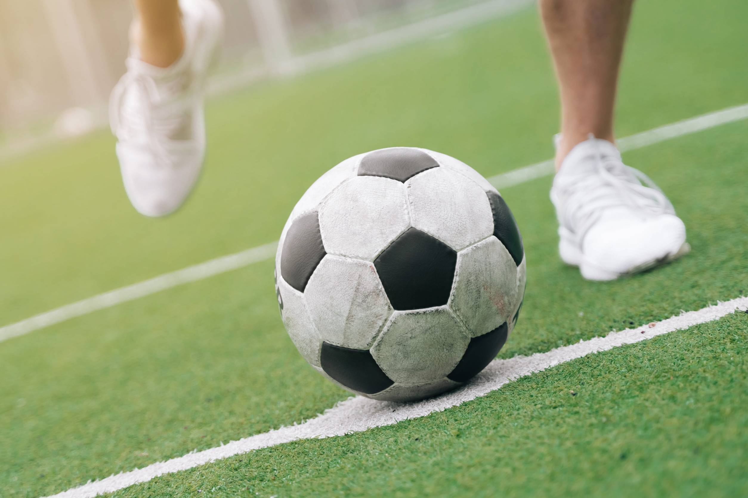 Man About To Kick A Football