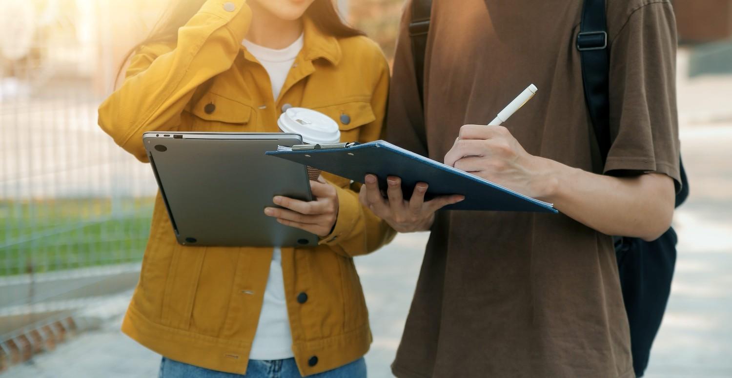 Students Walking And Studying Outside