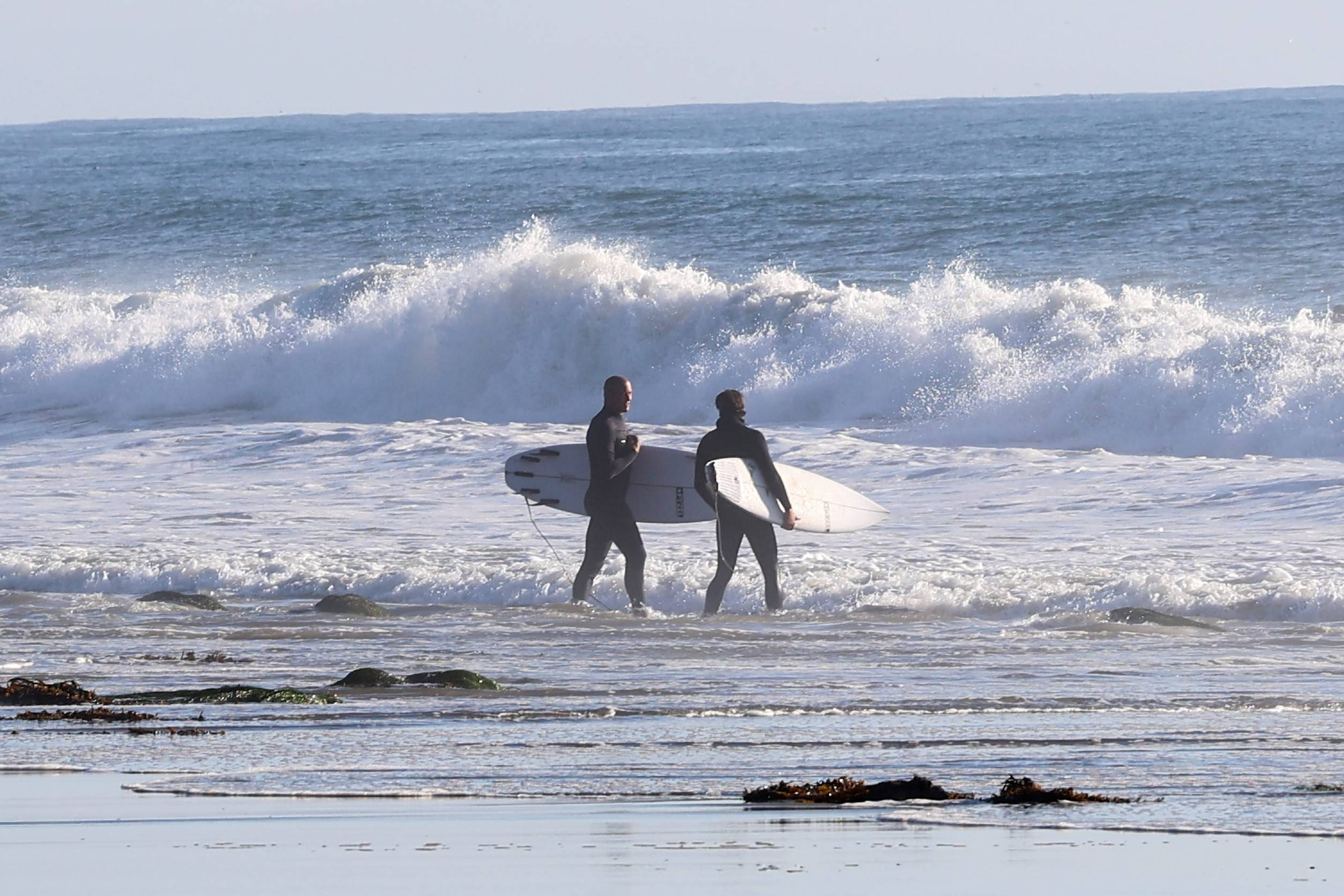 Surfers At The Beach