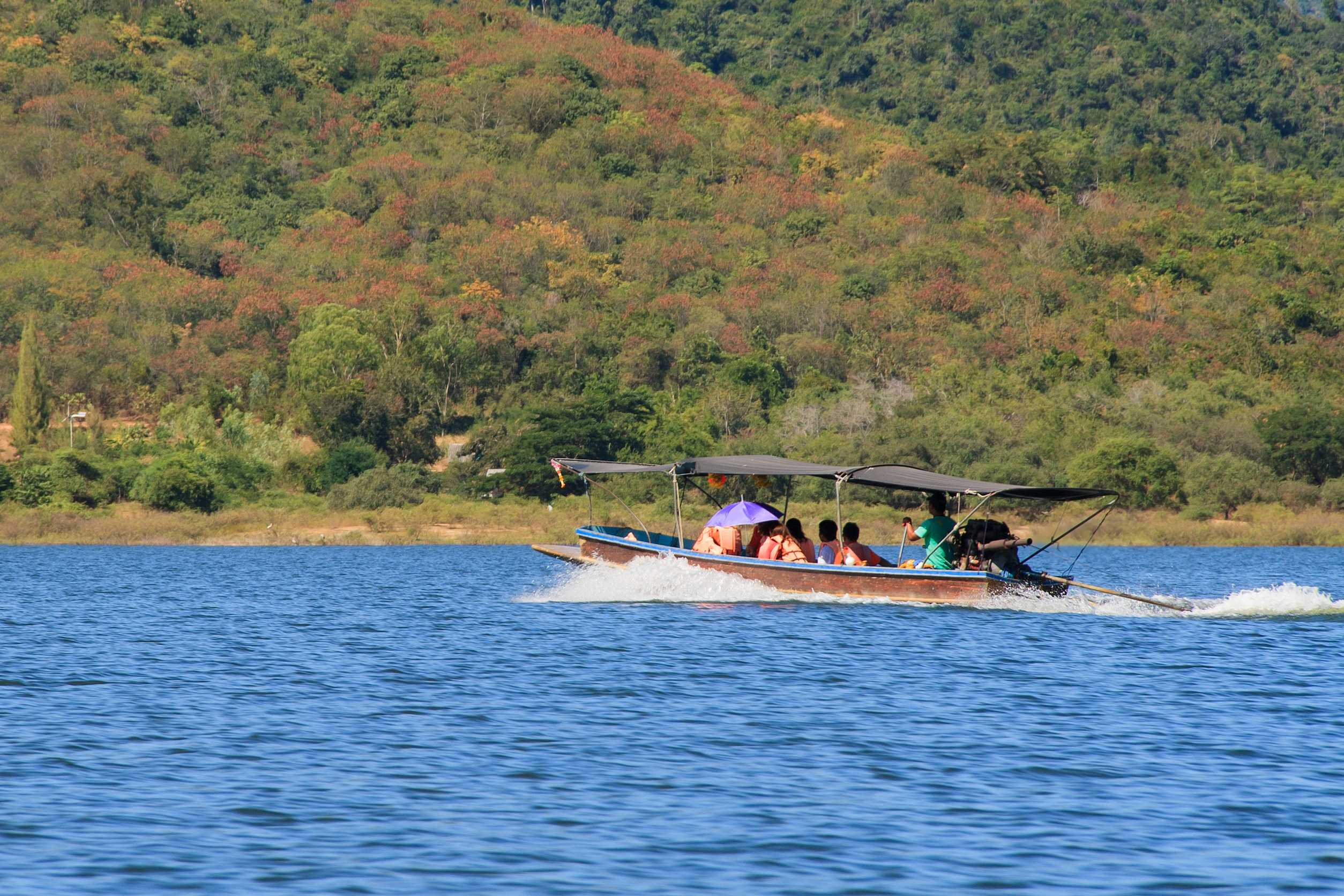 Tourists boating on scenic Gabon river